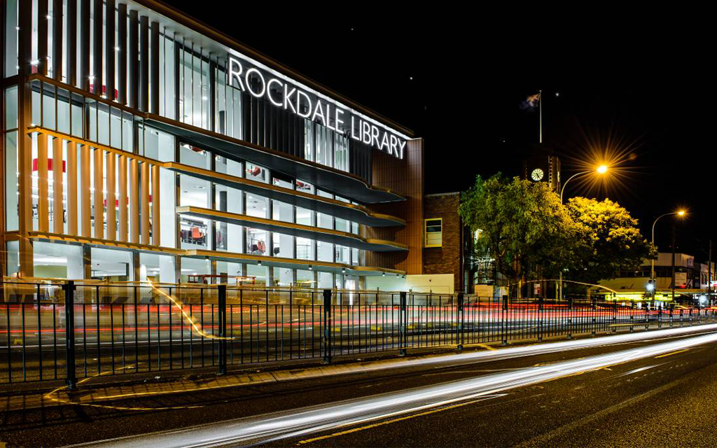 An outside view of Rockdale Library at night 